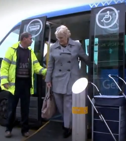 Our BAT Bus Our community bus picture of lady getting off the bus