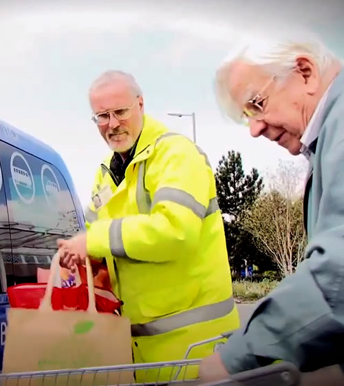 Volunteer Helping a member go shopping