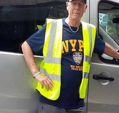 volunteer cars Picture of a volunteer stood by car door