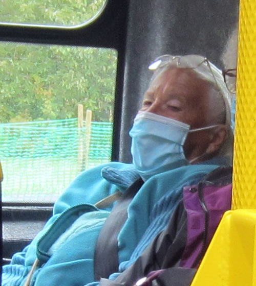 Picture of person on bus covid safe travel