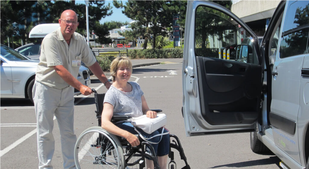 Lady in a wheelchair using the hospital hop service